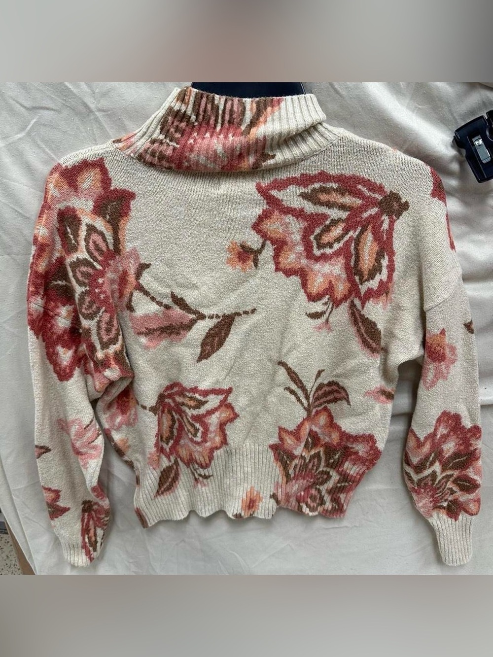 soft Pink and cream floral turtle neck long sleeve sweater.